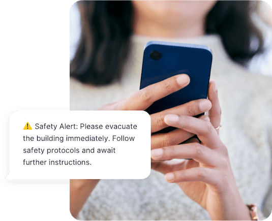 A property manager sends an SMS safety alert for all individuals to evacuate the building